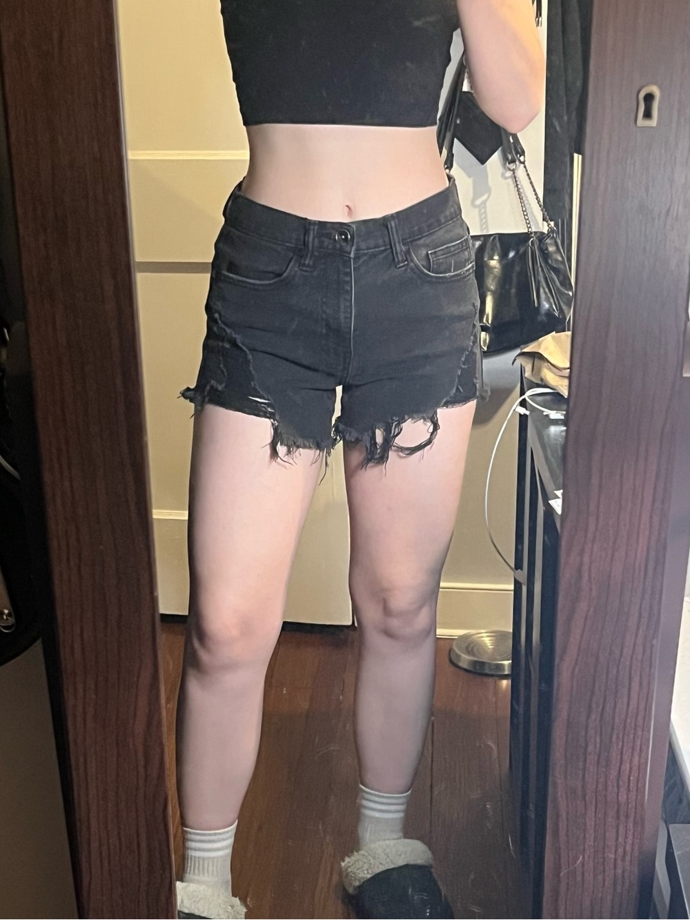 Black distressed jean shorts